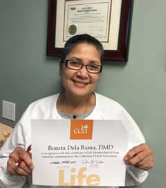 Photo of Dr. Bing receiving award from California Dental Association